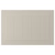 A beige STENSUND cabinet door with grooved panels and a smooth, lacquered surface.