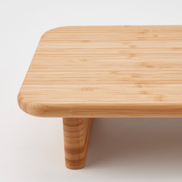 Minimalist bamboo coffee table with smooth, rounded edges and sturdy legs.