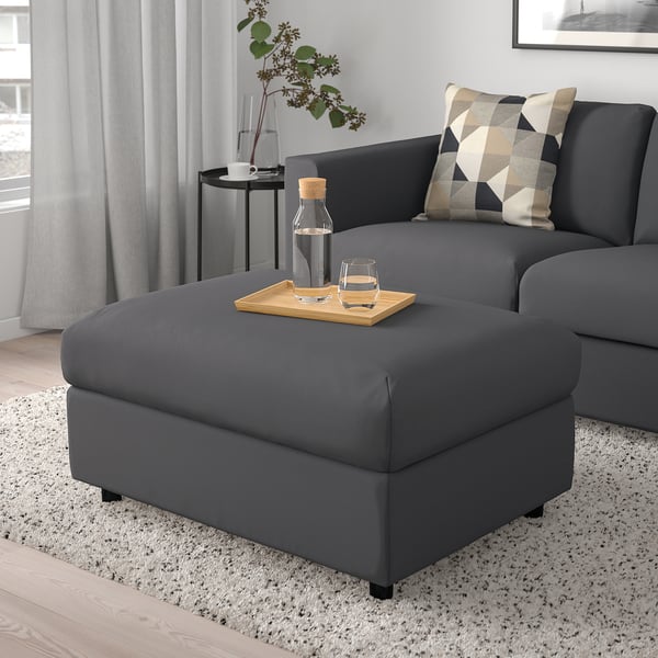 Modern living room with VIMLE sectional, ottoman, pillows, and large window.