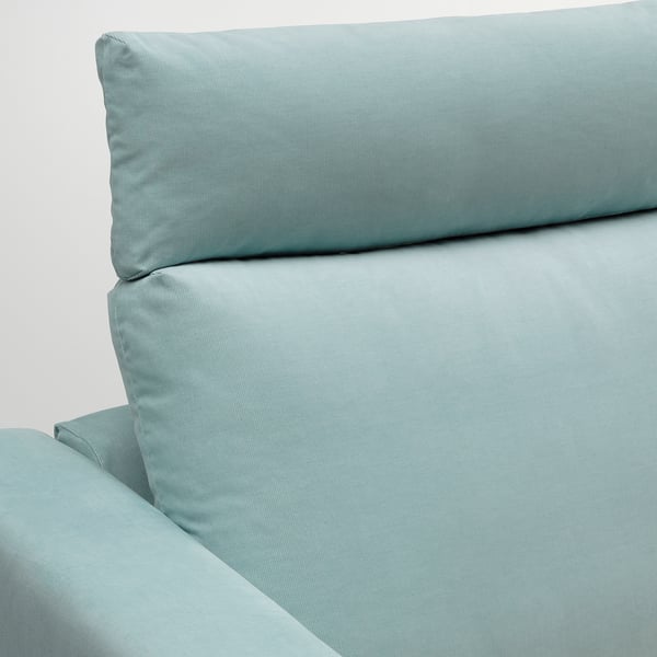 Light blue sofa cushion detail, soft fabric, clean design.