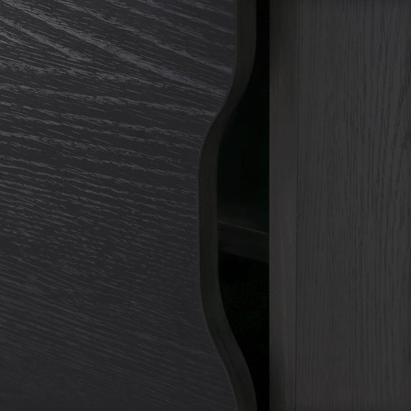Modern black wooden furniture, sleek finish, curving edges, quality craftsmanship, stylish design.