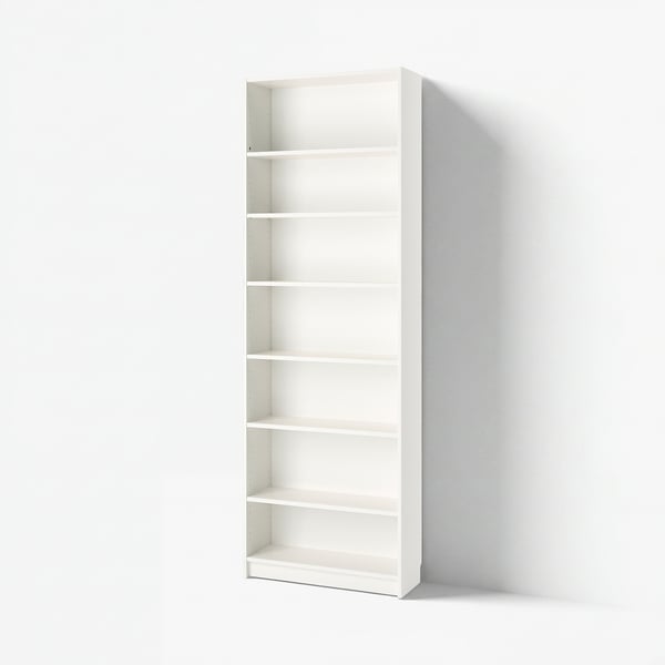 Empty white BILLY bookcase standing against a white wall. Six adjustable shelves, simple design.