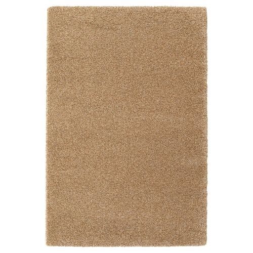 A beige rectangle rug named BREVBÄRARE made of polypropylene and synthetic rubber.