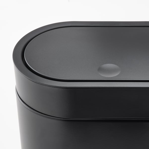 Modern black cylindrical rubbish bin with sleek, touch-open lid, showcasing high-quality materials and design.