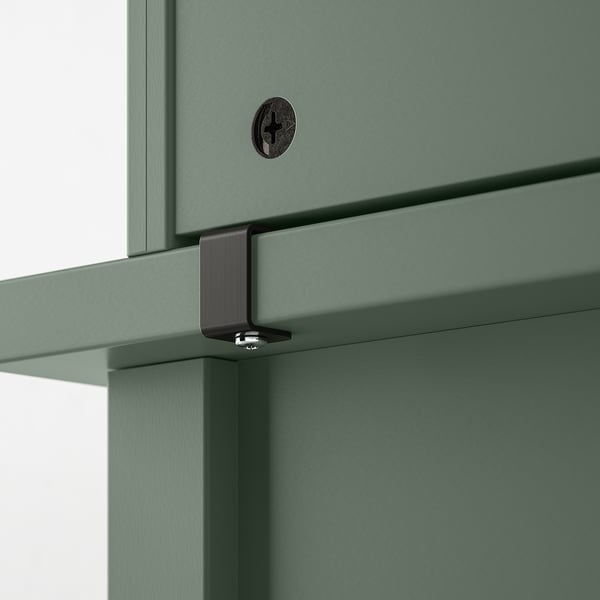 Green desk hutch with black metal support clips, providing extra storage and shelf space.