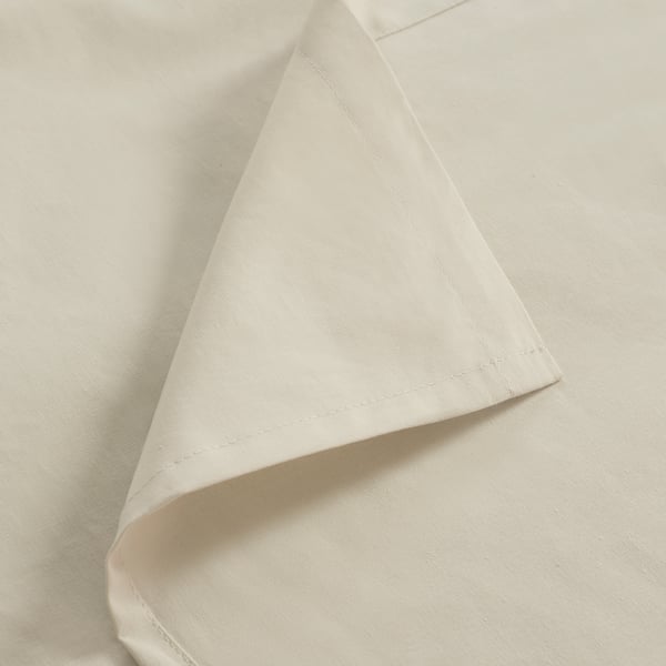 Folded white fabric, neatly pressed with smooth finish.