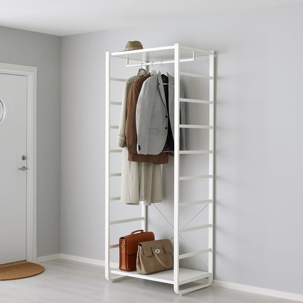 White metal storage unit with adjustable feet, hanging coats, and bags.
