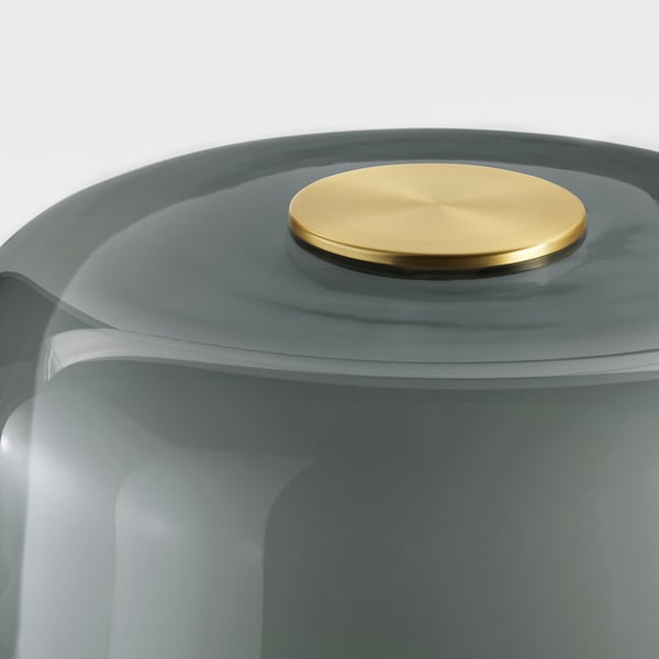 Sleek scandinavian lamp with brass top, smooth glass body and sturdy marble base showcasing quality craftsmanship.