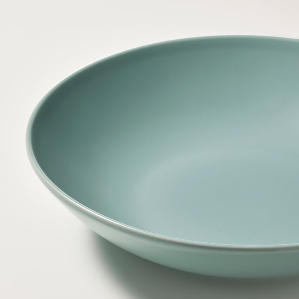 Large shallow bowl, light blue-green, smooth matte glaze, shallow rim.