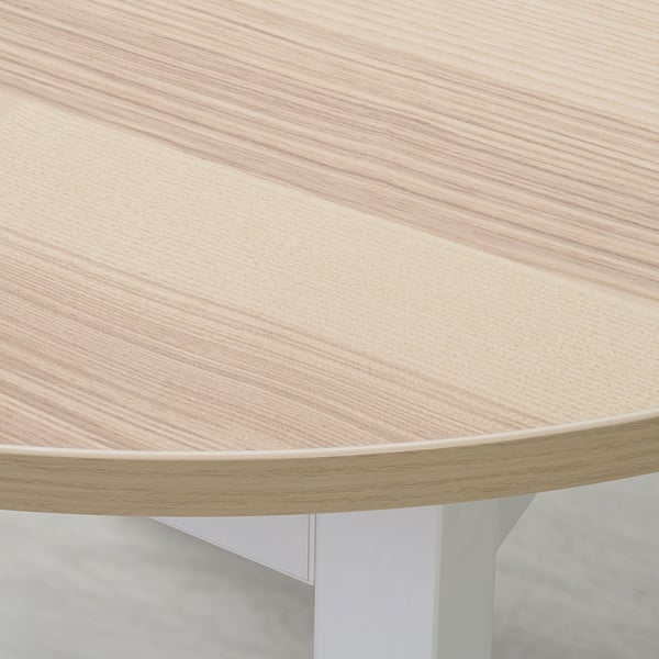 Smooth, light wood table top with clean edges, showcasing fine grain texture.