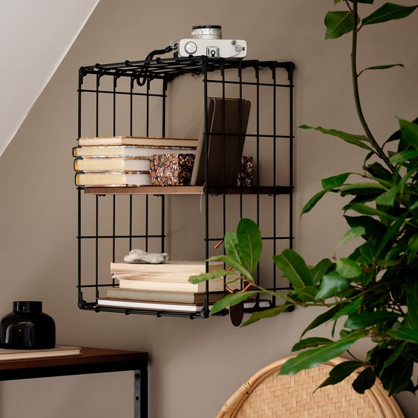 Black metal wall shelf, GULLHULT, holds books, camera, decor.