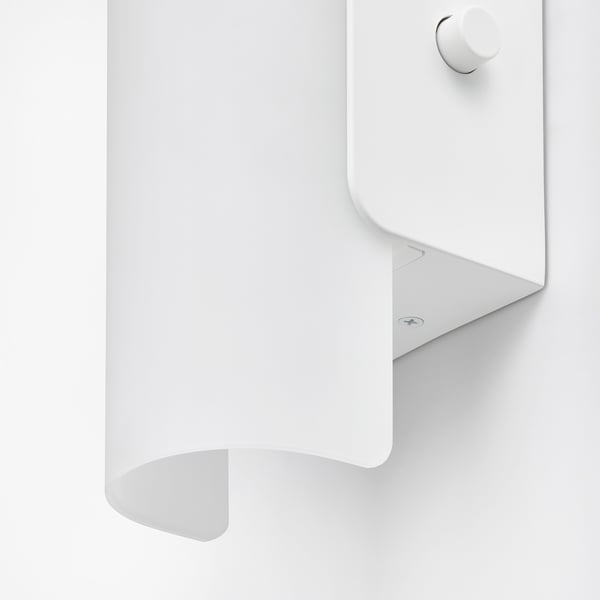 Modern wall lamp with frosted glass shade, clean design, high-quality materials.