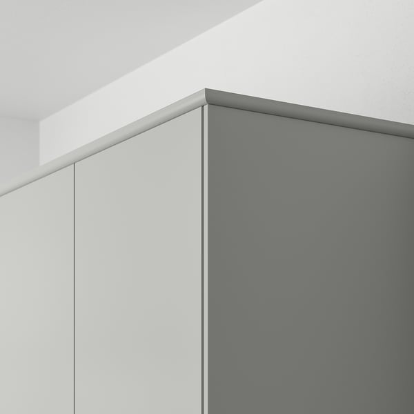 Angled close-up of smooth, light grey HAVSTORP kitchen panel with clean edges, showcasing its functional and sleek design.