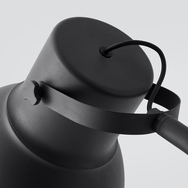 Black modern lamp with adjustable neck, featuring sleek metallic design and robust construction, chosen for durability and style.