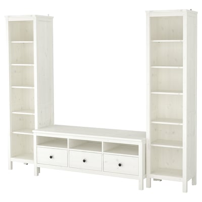 White HEMNES furniture: two tall bookcases and a wide tv stand, all with adjustable shelves.