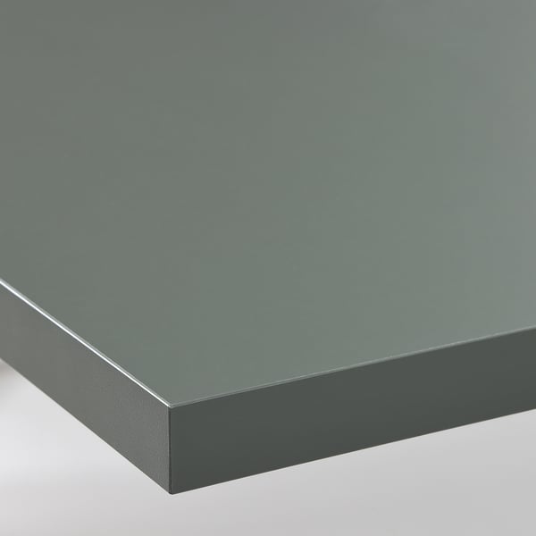 Close-up of a sleek, modern, matte grey kitchen worktop with straight edge detail.
