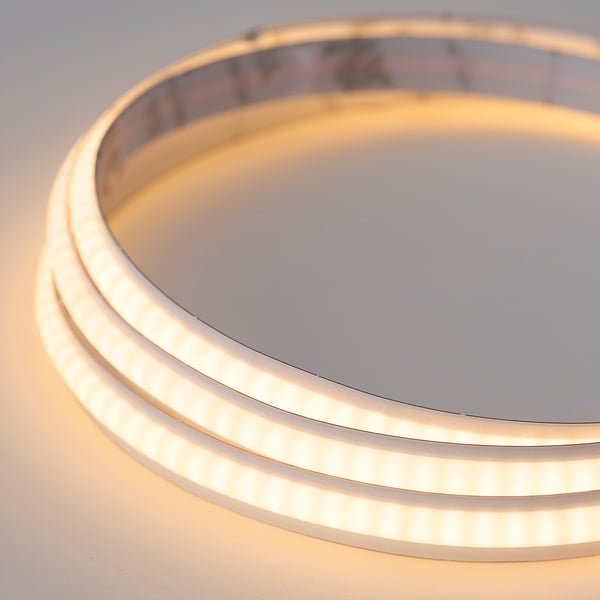 Close-up of modern round led light panel, sleek and brightly lit, showcasing high-quality design and warm illumination.