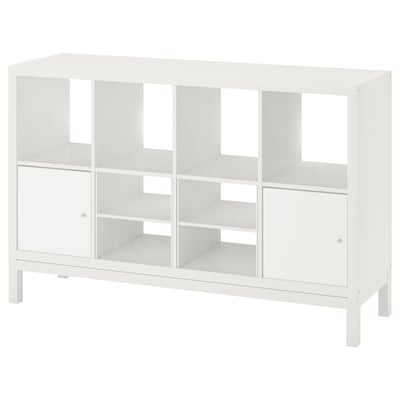 A white ikea KALLAX shelving unit with multiple compartments and a sleek, airy design.