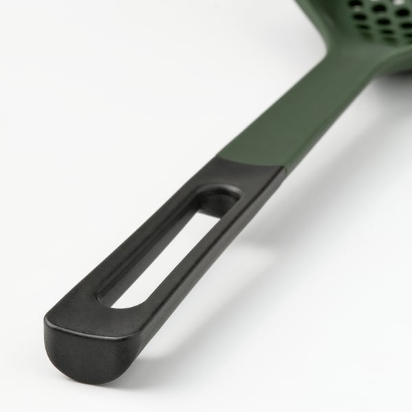 Green kitchen utensil handle with textured grip, smooth edge, and practical hanging hole.