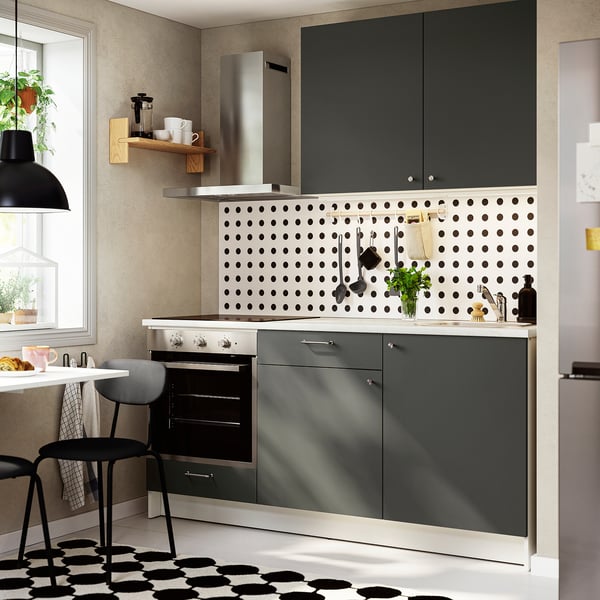 KNOXHULT dark grey kitchen set with marble counter, minimalistic design under black pendant.