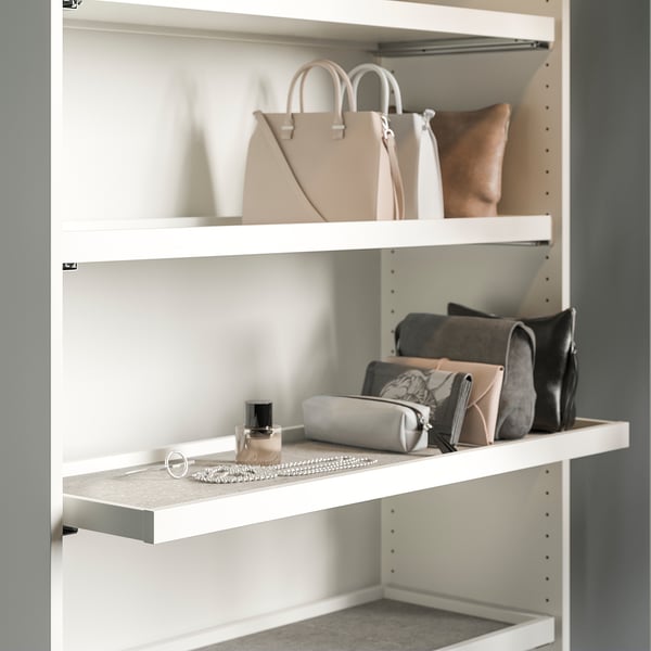 Closet shelf with handbags and jewellery. Or for a more concise version: closet shelf with bags and jewellery.