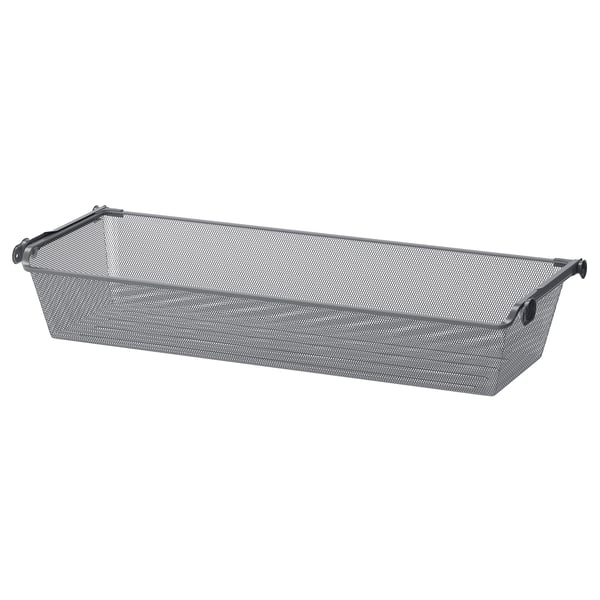 A KOMPLEMENT mesh storage basket in grey, rectangular in shape, with handles for easy access.