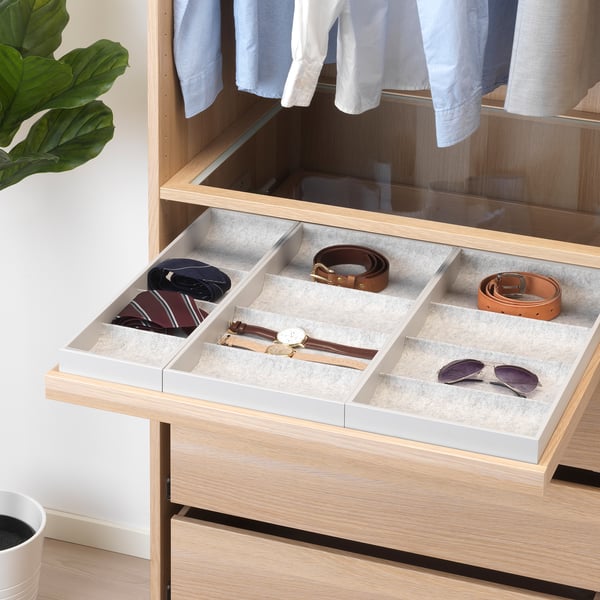 Drawer organiser with felt liners for ties, belts, watches, plus silent pull-out mechanism.
