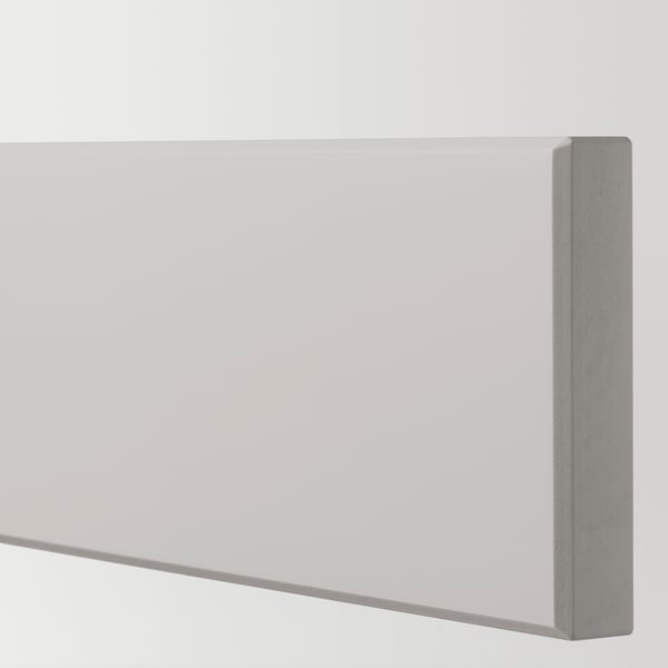 Close-up view of LERHYTTAN kitchen cabinet, showing smooth, bevelled edge and light grey finish.