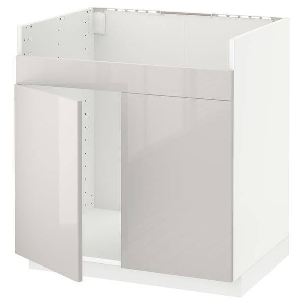 A white METOD kitchen cabinet. It has a high gloss finish and a modern, sleek design with clean lines.