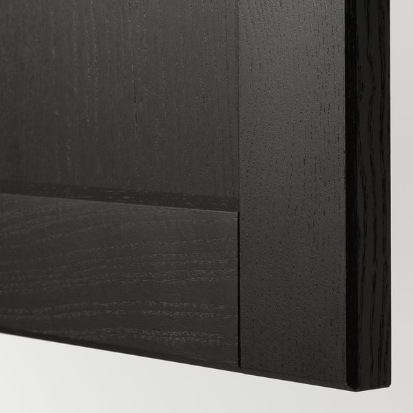 Black stained wooden panel with bevelled edges; smooth finish.