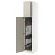 White METOD kitchen cabinet with beige havstorp doors, open showing pull-out organisers and metal hinges.