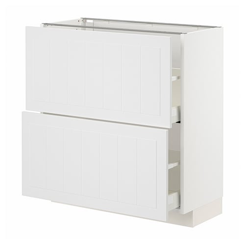 White METOD kitchen cabinet: two doors, two drawers, vertical grooves, modern design.