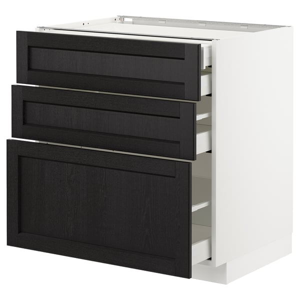 A METOD kitchen cabinet with three black stained wood drawers and a white base. It a traditional, warm design with bevelled edges on the drawers.