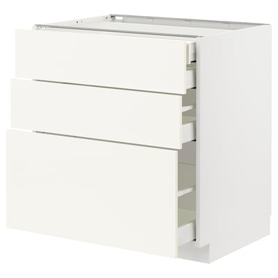 A white METOD kitchen unit with multiple drawers. The unit has a modern, minimalist design with smooth surfaces and sleek handles.