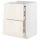 A white METOD kitchen cabinet with off-white bodbyn fronts, featuring two open drawers with bevelled edges.