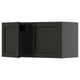 Black stained kitchen cabinet with bevelled edges and wooden design.