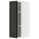 Black beveled-edge cabinet door, white wall unit, tall rectangular shape with 2 shelves.