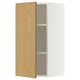 A white METOD wall cabinet with a light oak door open, revealing two glass shelves inside.