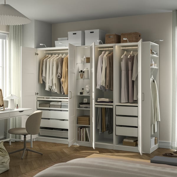 Modern wardrobe with compartments, drawers, adjustable feet, lighting, and wall mount.