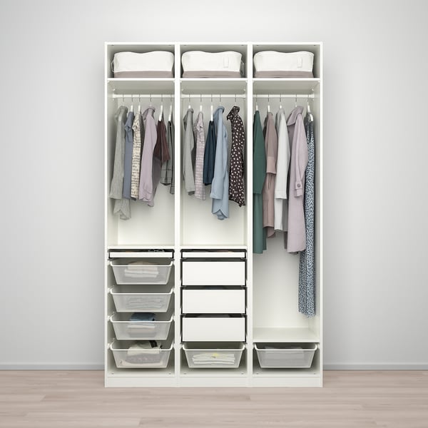 PAX wardrobe: hanging clothes, foldable baskets, pull-out trays for organising.