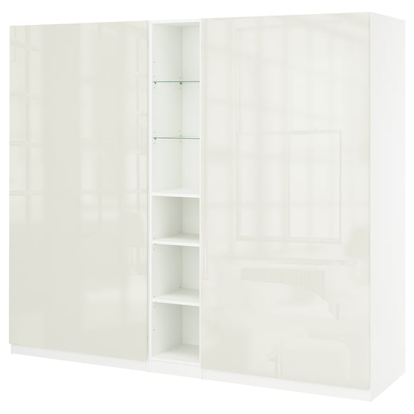 White PAX wardrobe with multiple doors, shelves, and drawers, sleek modern design, glossy finish.