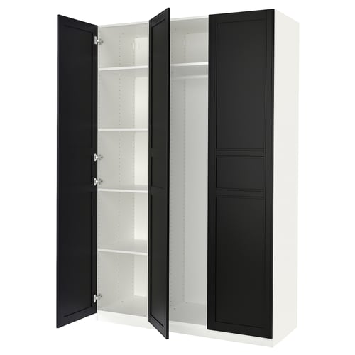 A white and black PAX wardrobe with open doors, revealing shelves inside.