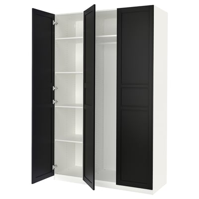 A white and black PAX wardrobe with open doors, revealing shelves inside.