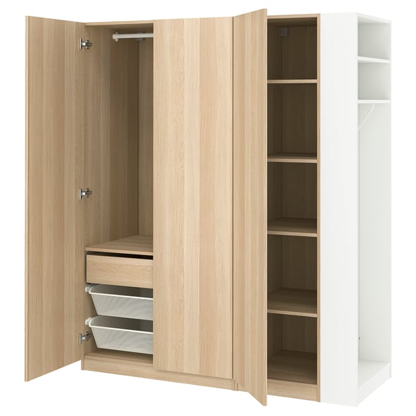 A light brown wood PAX wardrobe with open doors, revealing storage shelves and drawers. It has a simple, practical design.