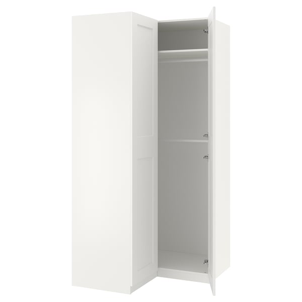 A white ikea PAX wardrobe with two open doors revealing empty shelves inside.