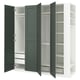 An open green IKEA PAX wardrobe. It shelves, drawers, and hanging storage with white interiors.