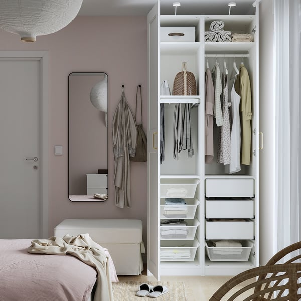 Compact PAX wardrobe with drawers, baskets, and hanging space. Adjustable, with integrated dampers for slow door close.