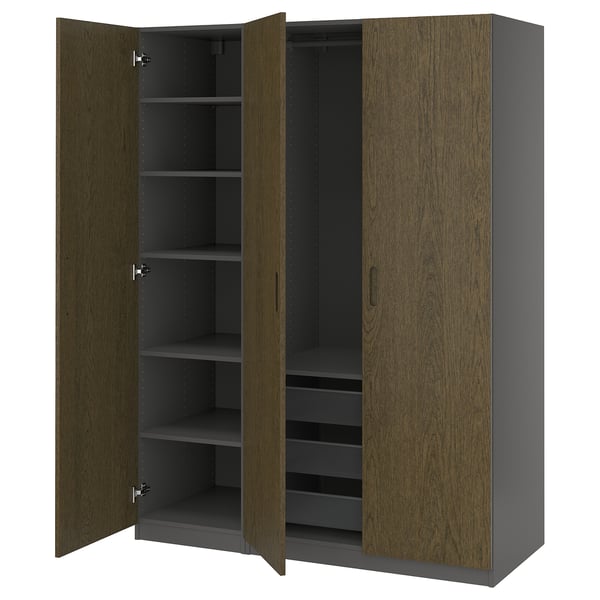 Displays an open PAX wardrobe in dark wood with multiple shelves and a mesh basket, showcasing its organised storage space.