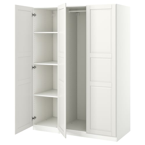 A white ikea PAX wardrobe with open doors, revealing empty shelves and storage space inside.
