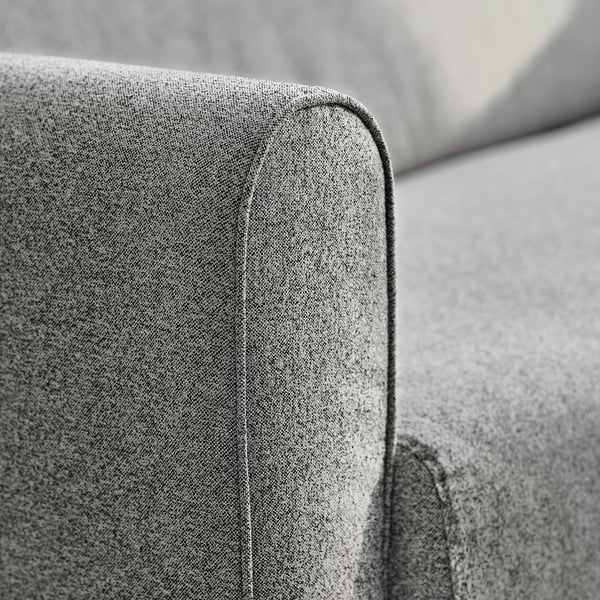 Sofa corner detail, showing smooth, high-quality upholstery and stitching.